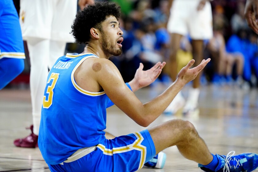 UCLA guard Johnny Juzang argues a foul called against him during the second half of an NCAA college basketball game against Arizona State Saturday, Feb. 5, 2022, in Tempe, Ariz. Arizona State won 87-84. (AP Photo/Ross D. Franklin)