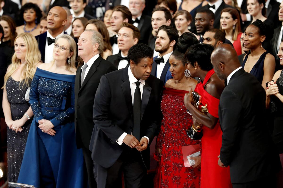 The audience reacts as the "Moonlight" cast and crew take the stage.