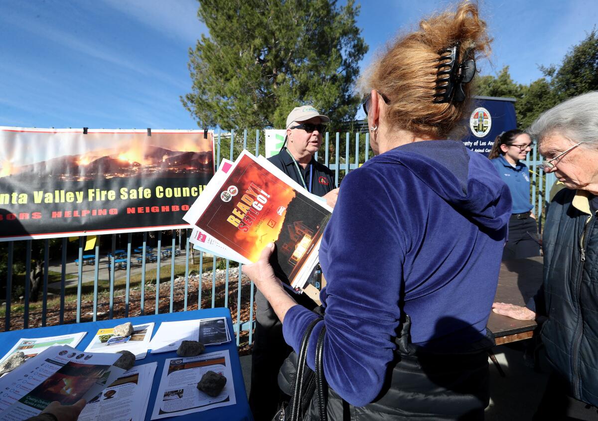 The Crescenta Valley Fire Safety Council had informational material at the evacuation center, Rosemont Middle School, during a fire drill conducted in the Paradise Valley area of La Cañada Flintridge on Saturday, Jan. 18, 2020.
