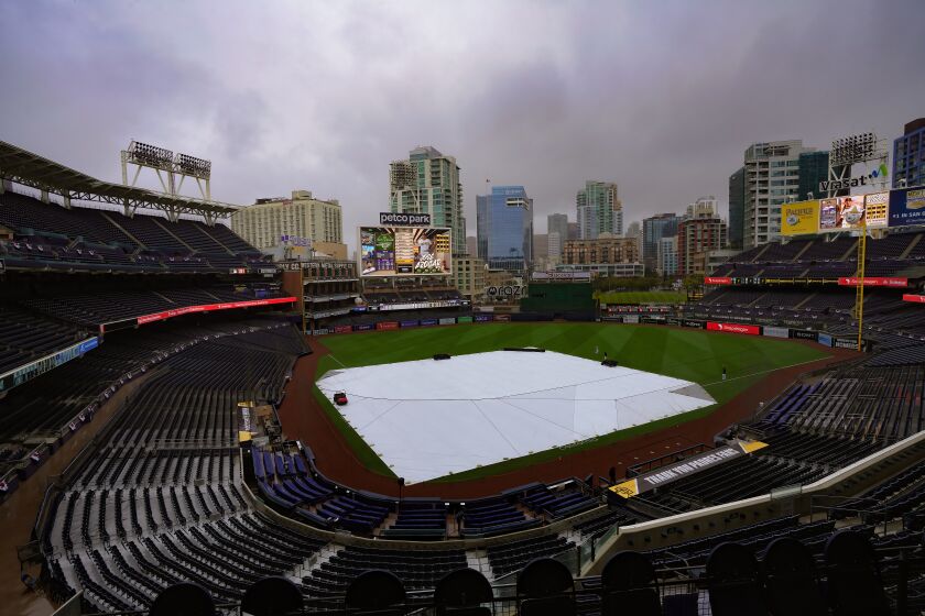 San Diego, CA - March 29: Due to rain the infield at Petco Park was covered on Wednesday, March 29, 2023 in San Diego, CA. and the workout and batting practice cancelled. (Nelvin C. Cepeda / The San Diego Union-Tribune)