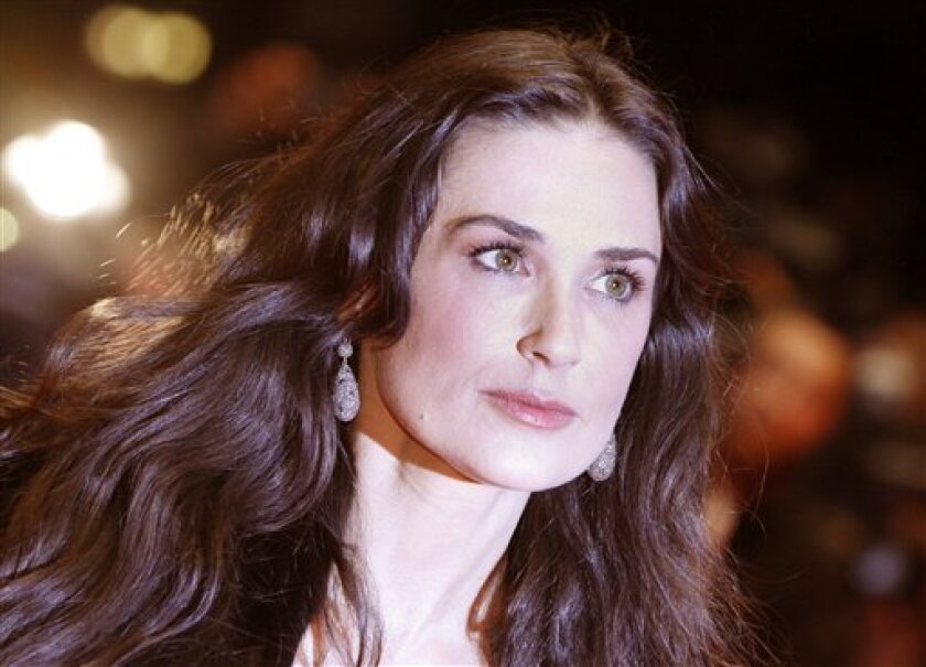 In this Feb. 11, 2009 file photo, actress Demi Moore arrives for premiere of the competition movie "Happy Tears" at the Berlinale in Berlin. (AP Photo/Markus Schreiber, file)