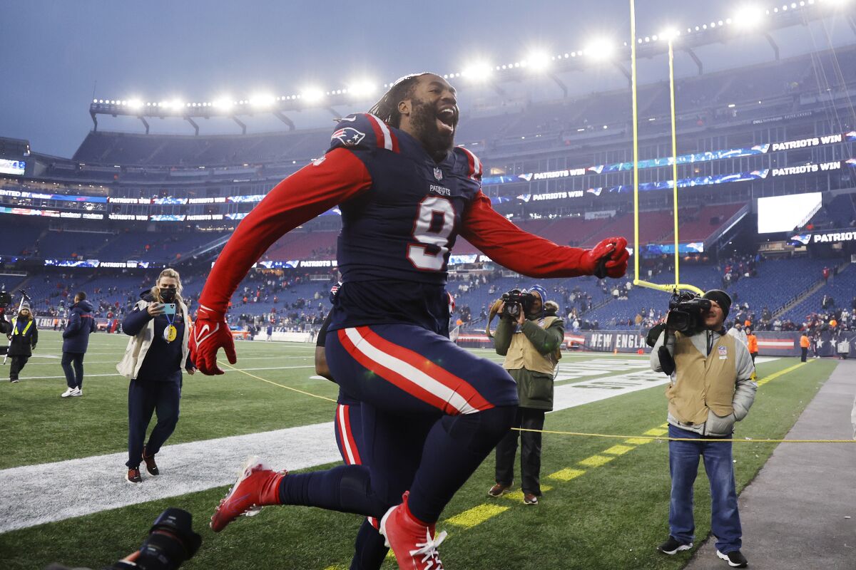 New England Patriots outside linebacker Matt Judon celebrates as he runs off the field following a 36-13 win over the Tennessee Titans after an NFL football game, Sunday, Nov. 28, 2021, in Foxborough, Mass. (AP Photo/Mary Schwalm)