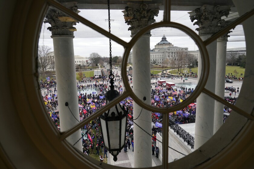 Violent protesters gather outside the U.S. Capitol, Wednesday, Jan 6, 2021. (AP Photo/Andrew Harnik)