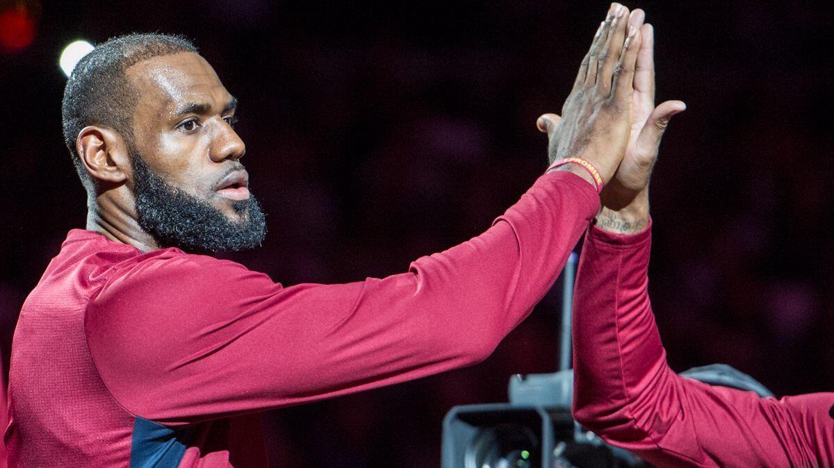 Cleveland Cavaliers' LeBron James is introduced before a preseason game against the Chicago Bulls on Oct. 10.