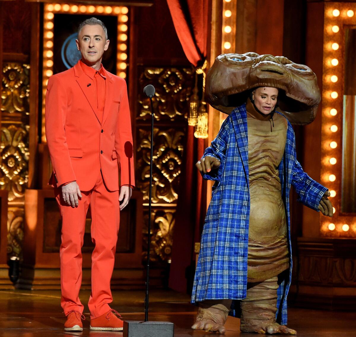 Hosts Alan Cumming and Kristin Chenoweth stage another stunt.