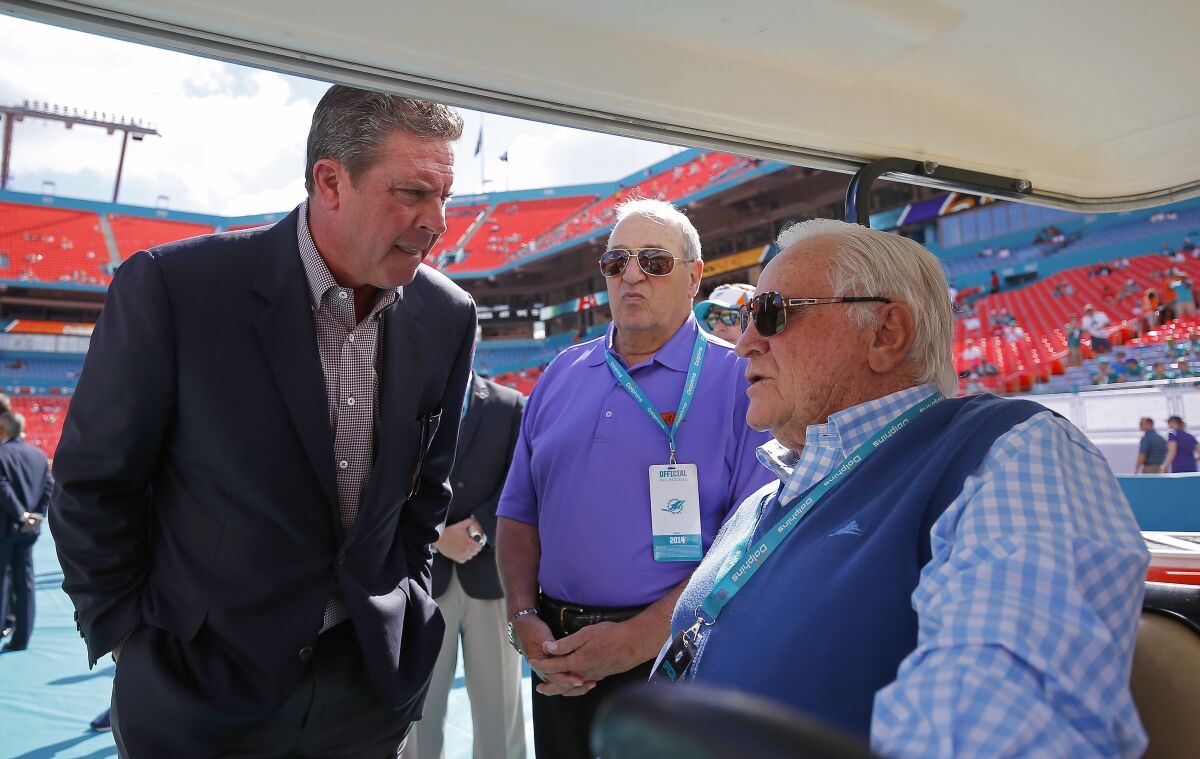 Former Miami Dolphins quarterback Dan Marino, left, speaks with Don Shula.