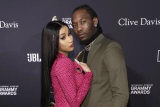 Cardi B, left, and Offset arrive at the pre-Grammy gala 