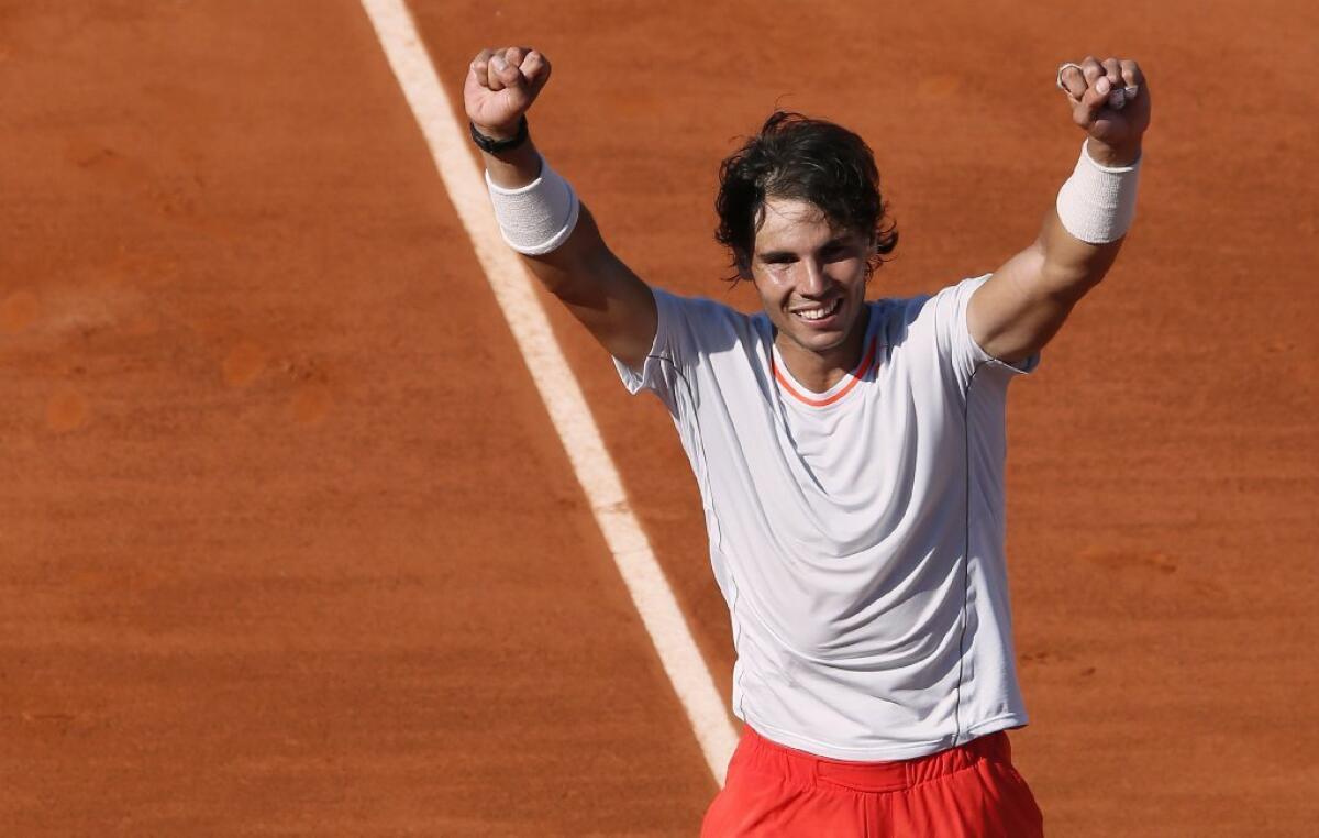 Rafael Nadal celebrates his victory over Novak Djokovic.