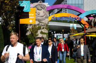 Attendees exit the Dreamforce convention downtown on Thursday in San Francisco.