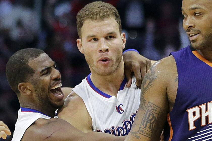 Chris Paul, left, celebrates with Blake Griffin, who hit a game-winning three-pointer against the Phoenix Suns on Dec. 8.