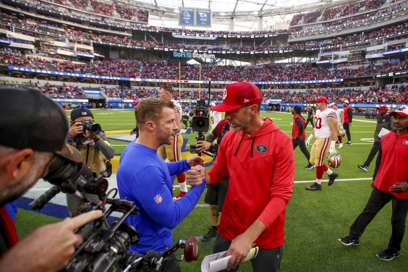 Rams coach Sean McVay (left) and 49ers coach Kyle Shanahan shake hands.