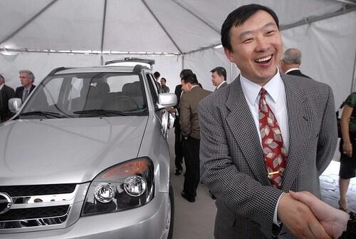 Robert Yu, president of the Chinese car manufacturer Hebei Zhongxing Automobile Manufacturing Co., is all smiles last June during a presentation of the company's car models in Tijuana. Chamco Automotive has been trying to be the first to bring the Chinese-made ZX models to North American showrooms but has been embroiled in legal wranglings.