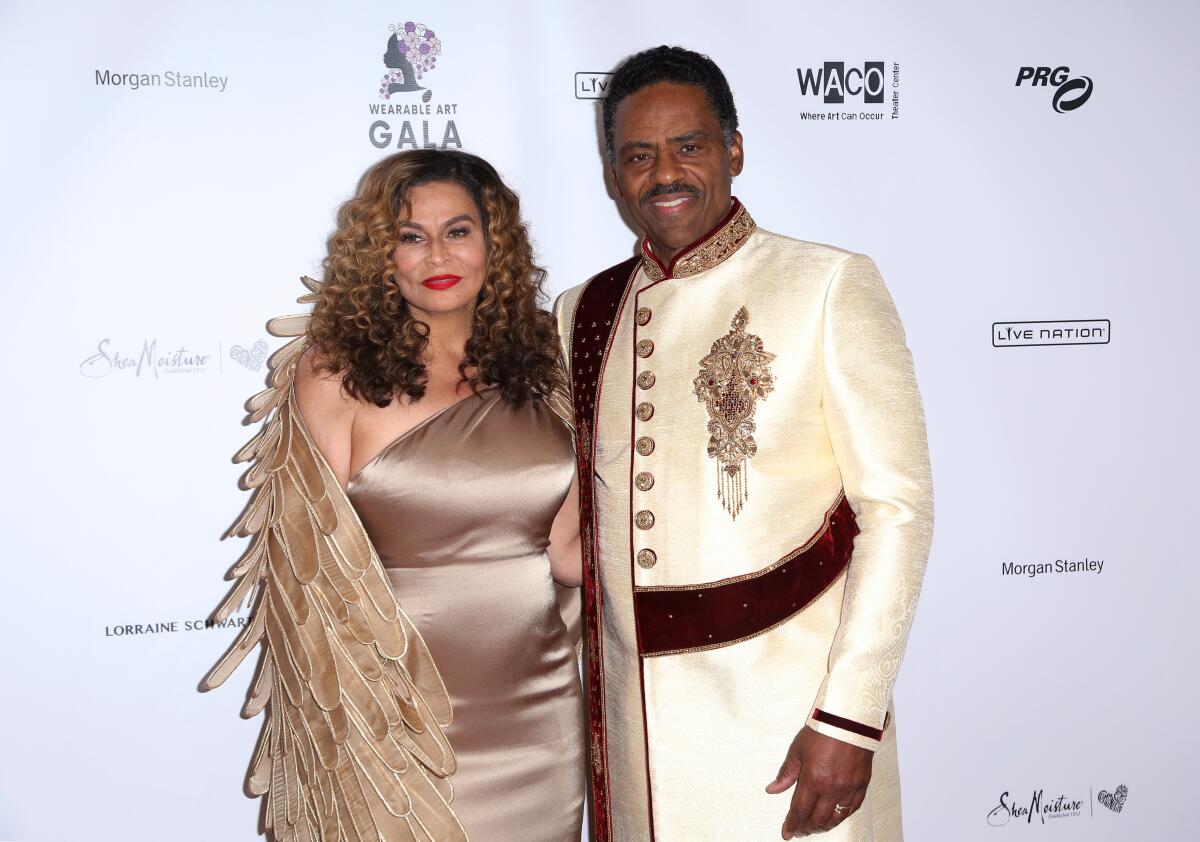 Tina Knowles Lawson, left, and Richard Lawson arrive at an art gala