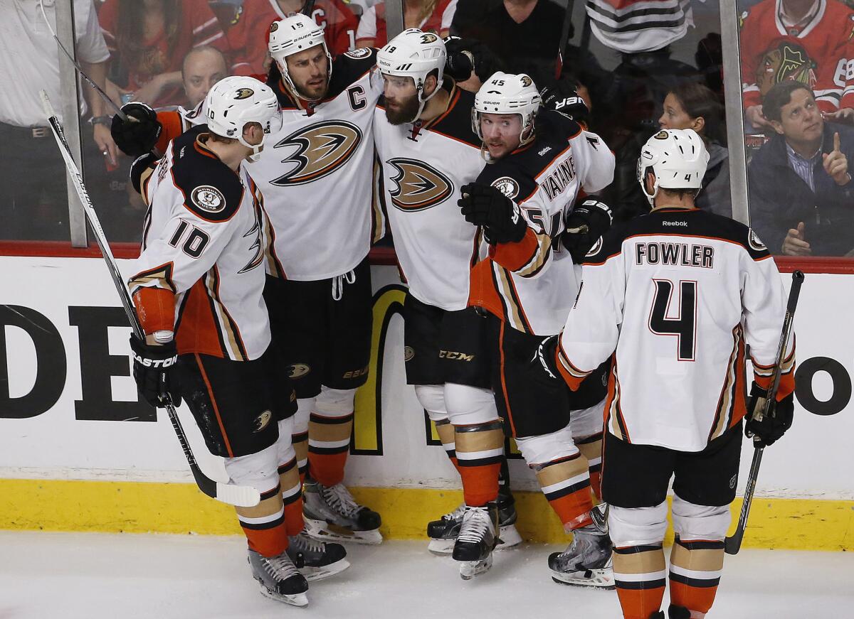 Ducks left wing Patrick Maroon, third from left, celebrates after scoring a goal against the Chicago Blackhawks on Wednesday.
