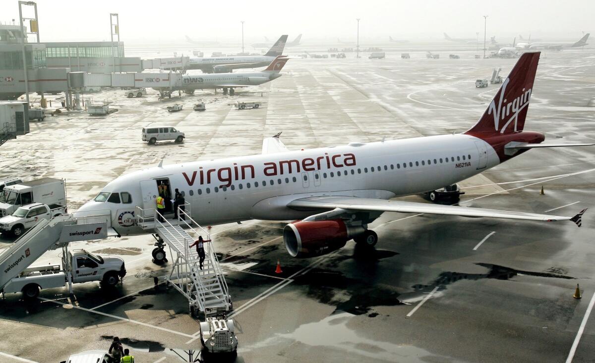 A Virgin America plane waits to depart from New York's Kennedy Airport.