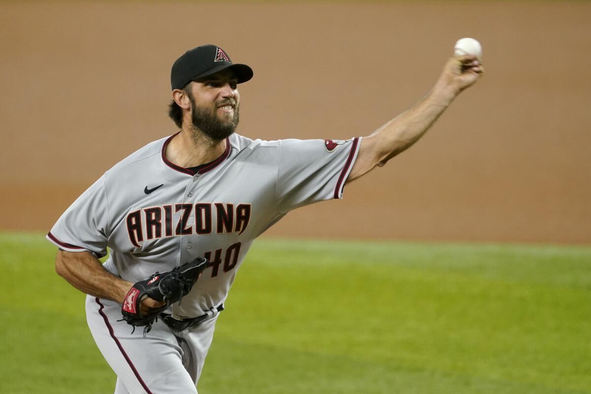 Bumgarner wins pitching duel as D-backs edge Rangers 3-2 - The San Diego  Union-Tribune