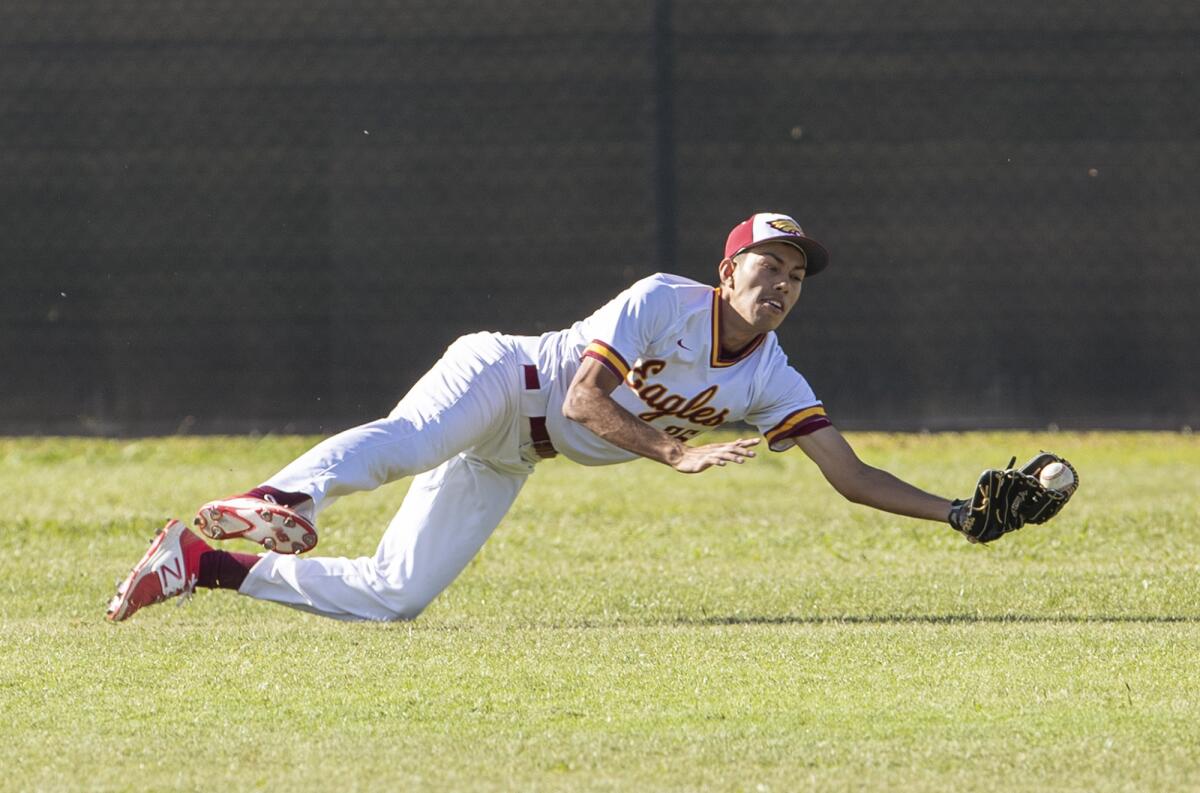 Estancia High's Josh Caldales makes a diving catch on a ball hit by Costa Mesa's Miguel Rodriguez during an Orange Coast League game on Wednesday.