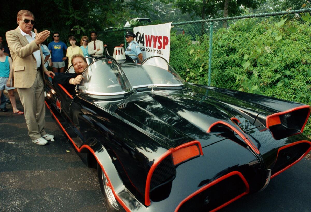In this June 27, 1989, file photo, the original Batman, Adam West, left, stands beside the old Batmobile driven by owner Scott Chinery in Philadelphia. A federal appeals court ruled the caped crusader's vehicle is entitled to copyright protection.