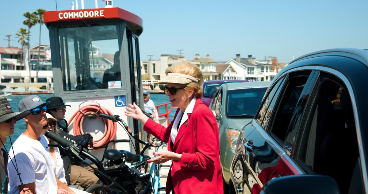 Assemblywoman Diane Dixon (R-Newport Beach) speaks with riders of the Balboa Island Ferry during filming of the docuseries.