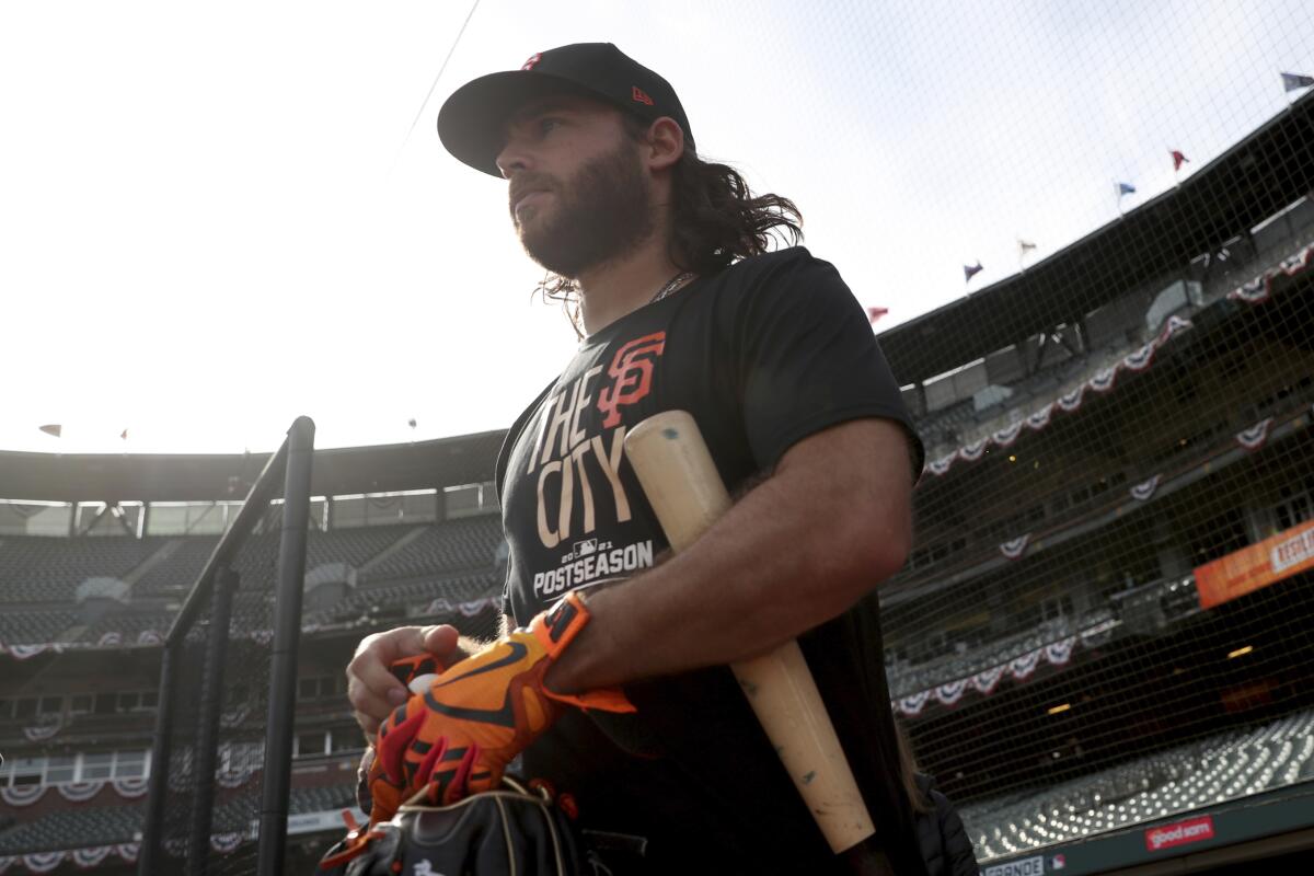 San Francisco's Brandon Crawford walks onto the field at Oracle Park for a workout on Thursday.