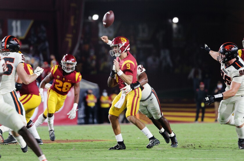 Oregon State linebacker Avery Roberts forces USC quarterback Kedon Slovis to fumble in the third quarter Saturday.