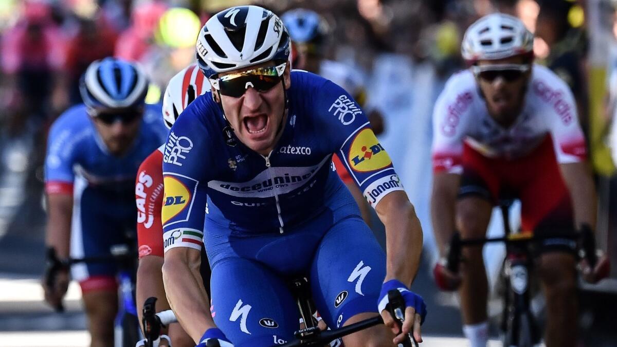 Italy's Elia Viviani crosses the finish line to win Stage 4 of the Tour de France between Reims and Nancy,