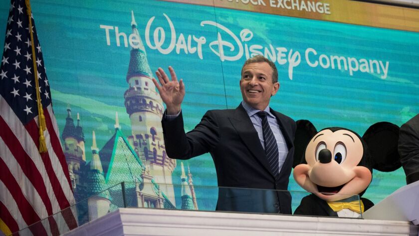 Walt Disney Co. CEO Bob Iger and Mickey Mouse ring the opening bell at the New York Stock Exchange in November.