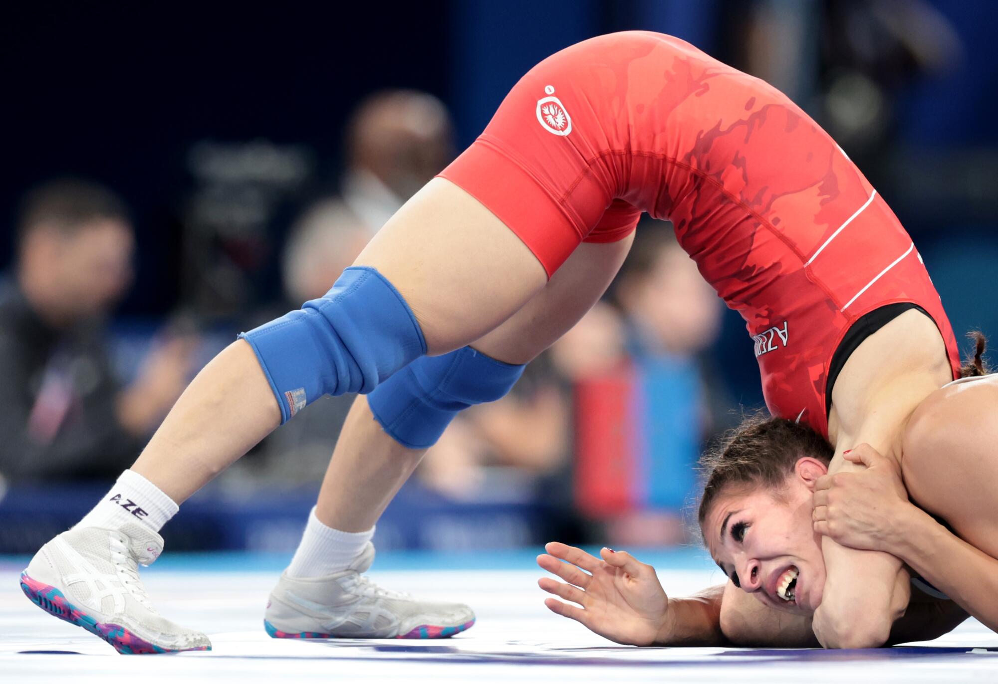 Azerbaijan's Maria Stadnik, left, battles Germany's Anastasia Blayvas in the women's freestyle wrestling.