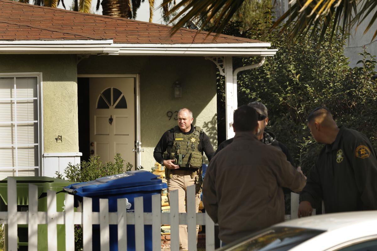 Sheriff's deputies search the home of Paul Flores in February 2020 in connection with the case of missing student Kristin Smart, who vanished from Cal Poly San Luis Obispo in 1996.