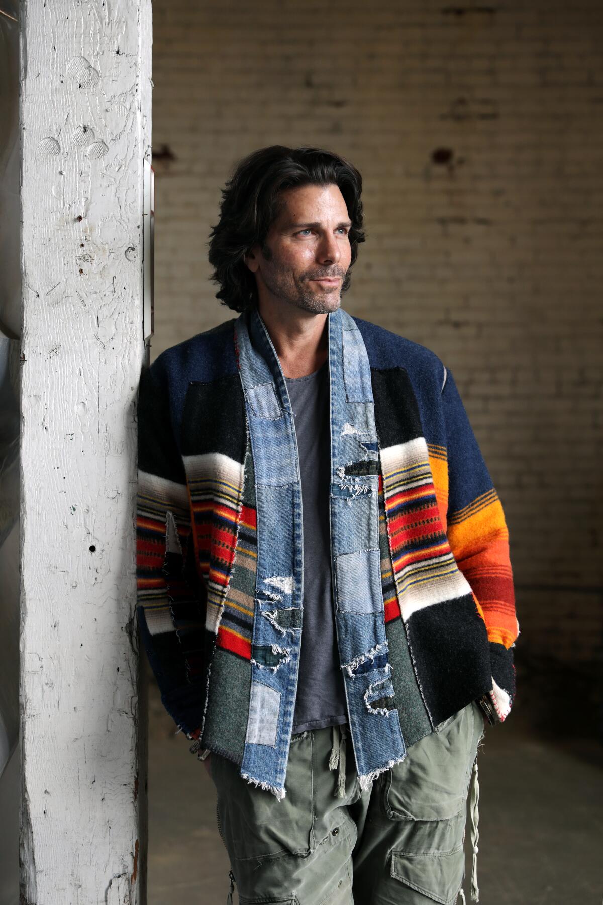 Designer Greg Lauren wears a jacket from the fall and winter 2020 Greg Lauren GL Scraps collection.