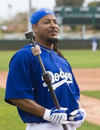 Slugger Manny Ramirez prepares to take his first batting practice with the Dodgers on Thursday at Camelback Ranch in Phoenix.