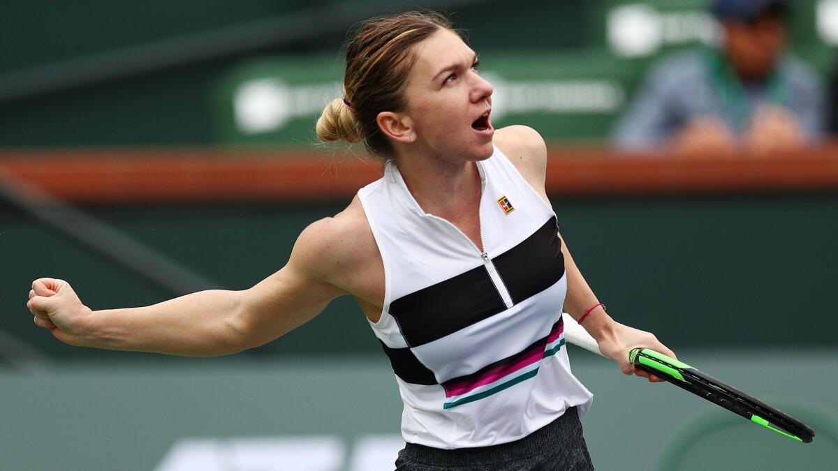 Simona Halep celebrates her victory over Kateryna Kozlova at the BNP Paribas Open at the Indian Wells Tennis Garden.