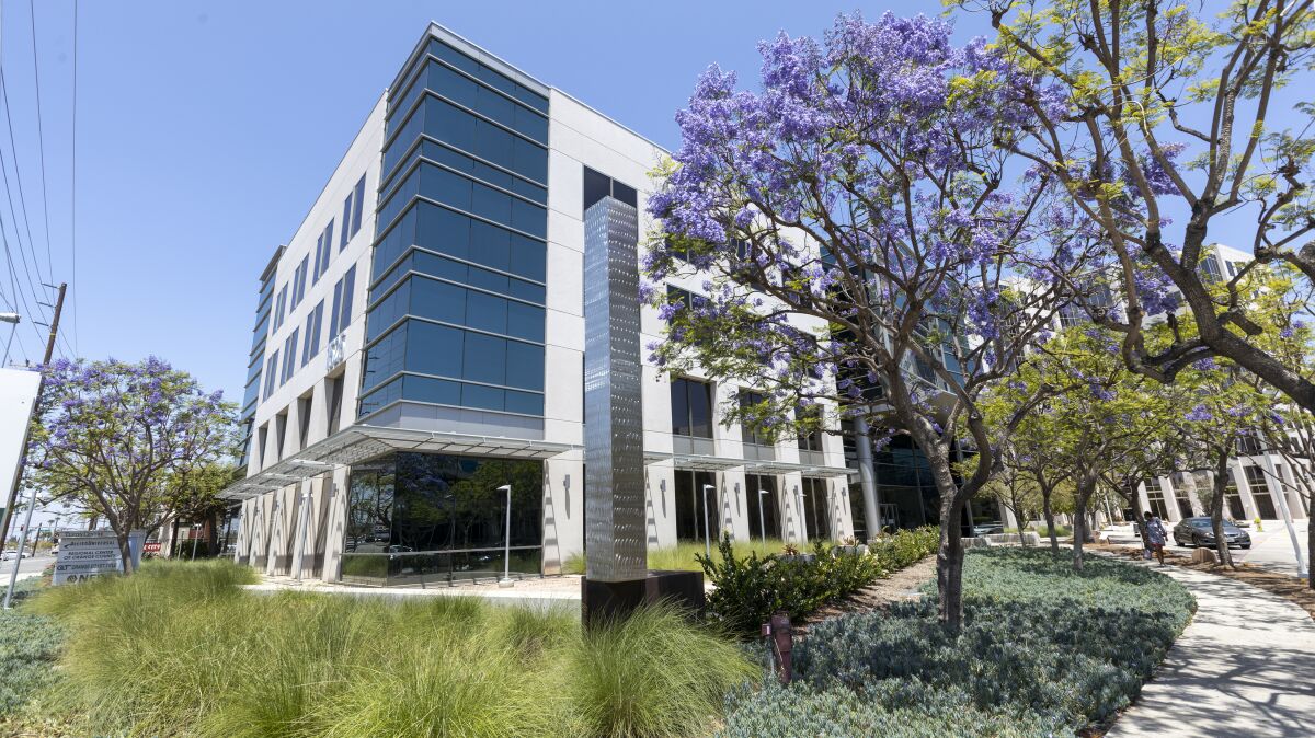 Exterior view of a concrete and glass office building.