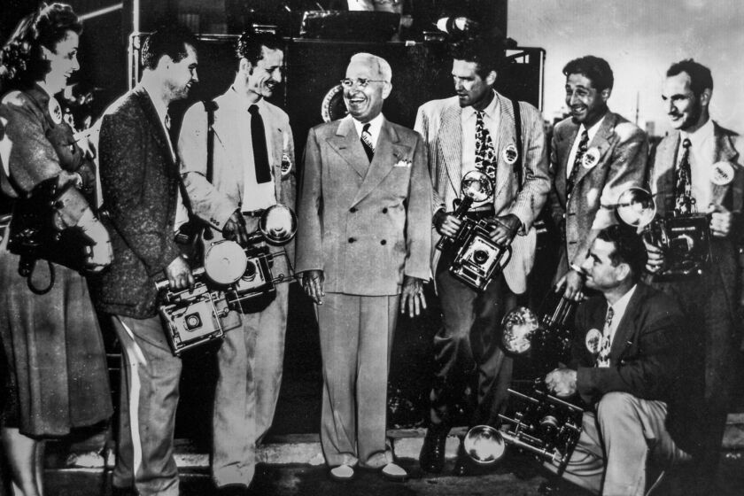 During a campaign stop, President Harry Truman poses with Speed Graphic-equipped Los Angeles photographers at Union Station.