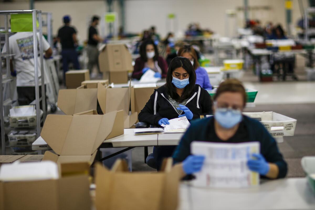 Mail in ballots are processed at a county facility