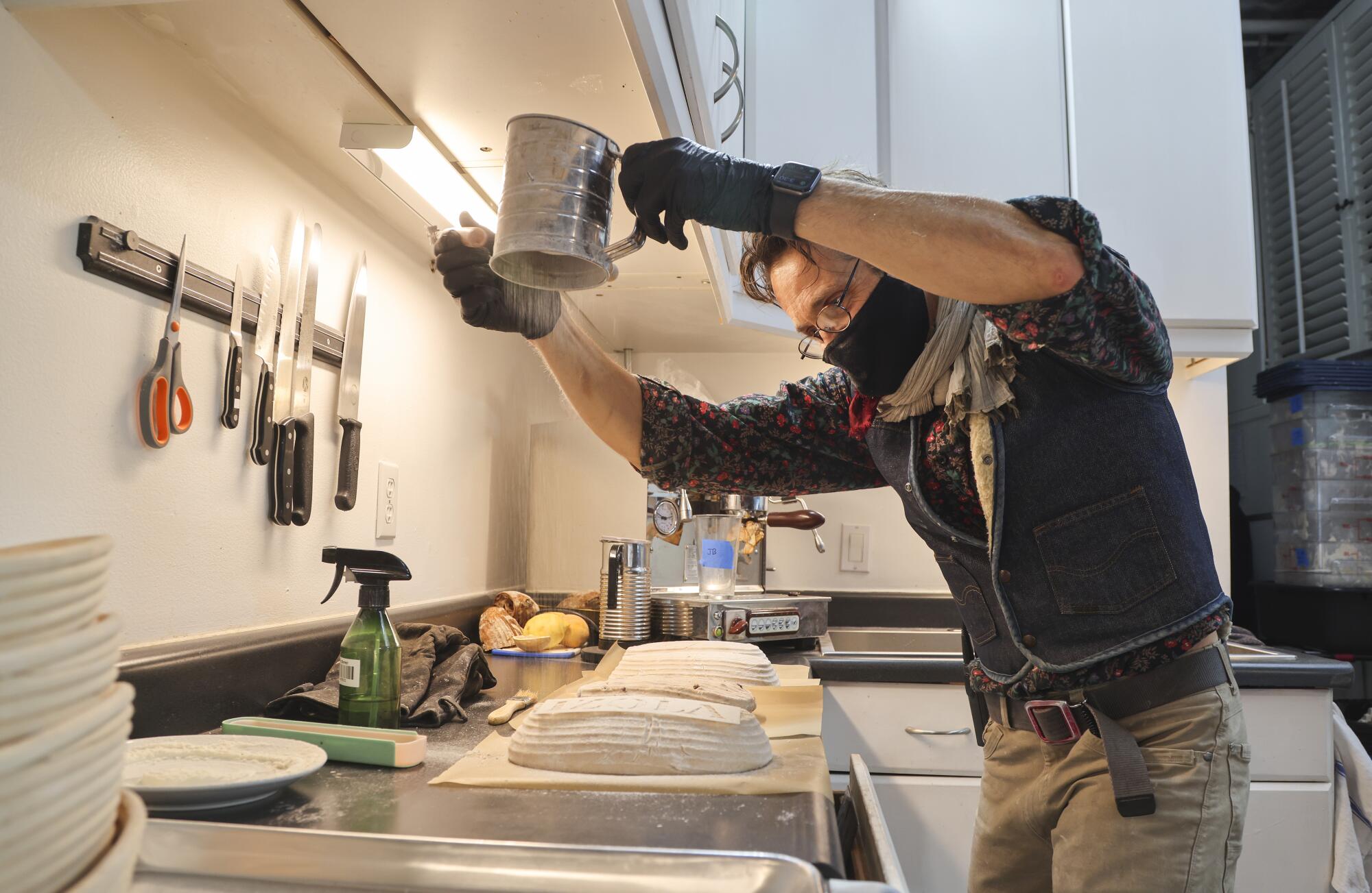  Jeffrey Lamont Brown bakes sourdough bread at Izola Bakery.