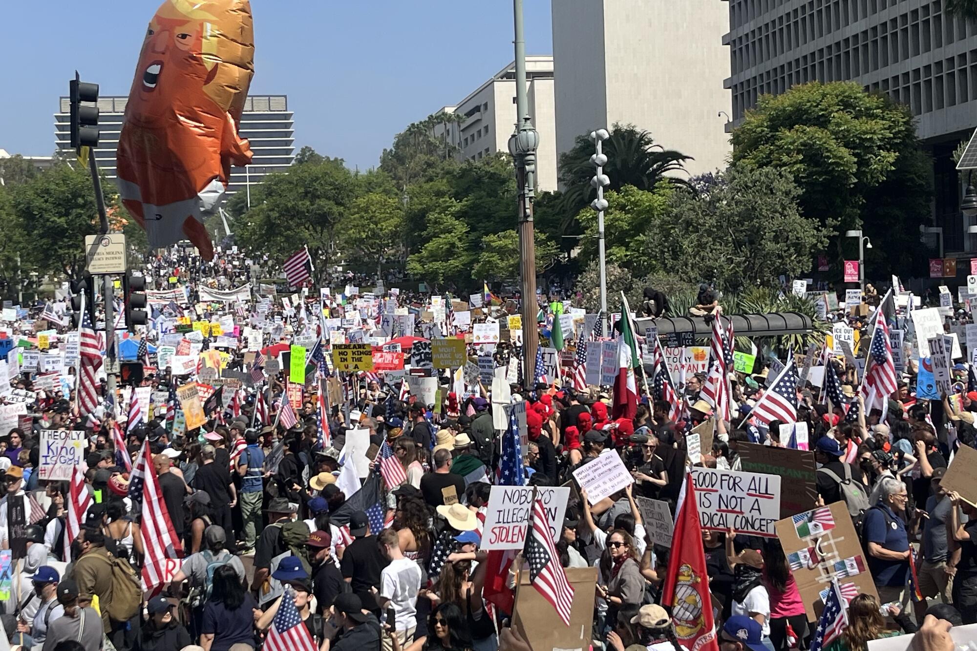 Hundreds participate in the "No Kings" Day demonstration in front of City Hall.