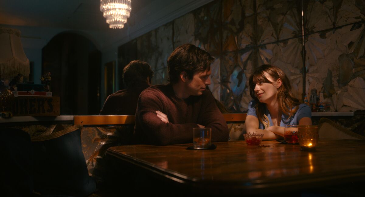 A man and a woman in a restaurant booth in the movie “Fresh.”