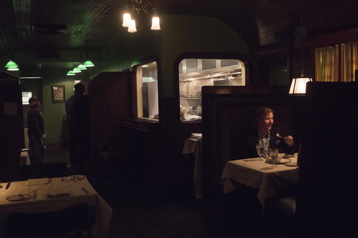 Steve Massey eats with a friend at the Dining Car.
