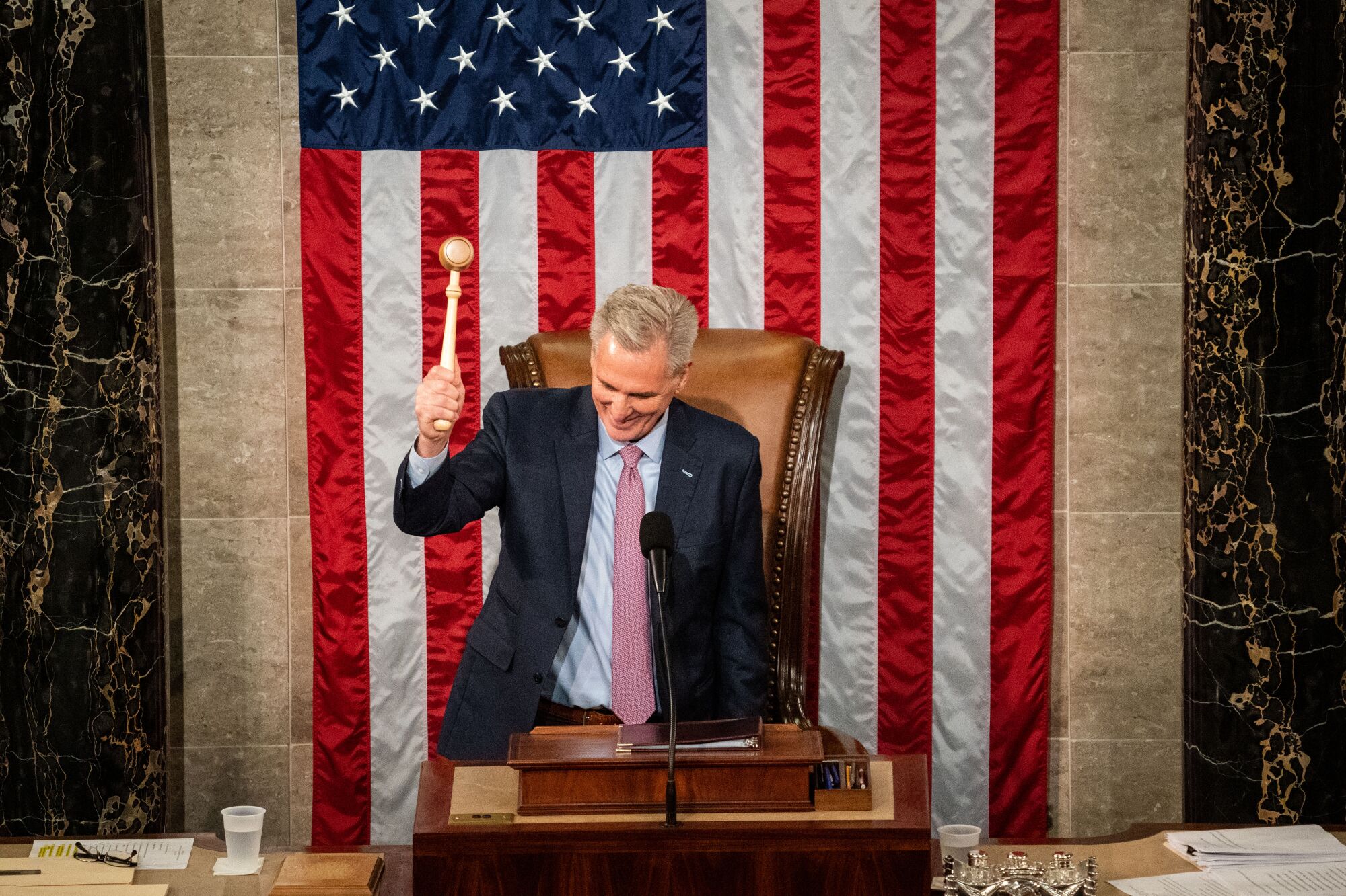 Kevin McCarthy prepares to bang the gavel while standing before the House chamber