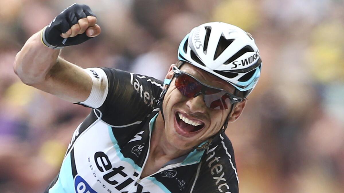 Germany's Tony Martin celebrates as he wins the fourth stage of the Tour de France in Cambrai, France, on Tuesday.