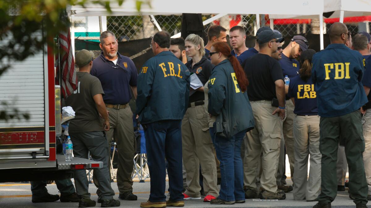 FBI investigators gather Monday morning outside the Pulse nightclub.
