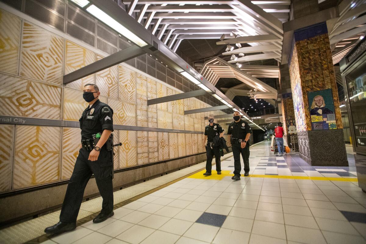LAPD officers patrol Metro's Hollywood/Highland station on June 25, 2020. 