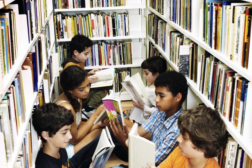 children reading on floor in library stacks (books, biblioracle, kids reading, diverse) ** OUTS - ELSENT, FPG - OUTS * NM, PH, VA if sourced by CT, LA or MoD **