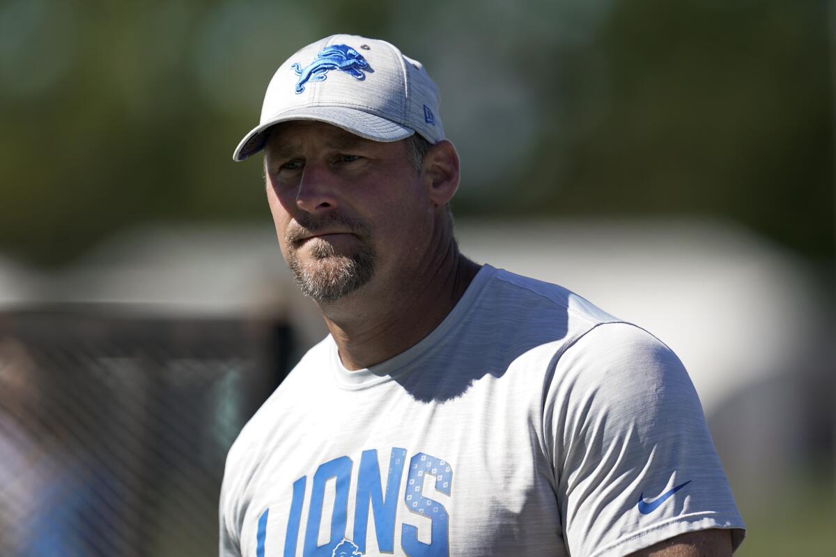 Detroit Lions head coach Dan Campbell watches during an NFL football practice in Allen Park, Mich., Friday, July 29, 2022. (AP Photo/Paul Sancya)
