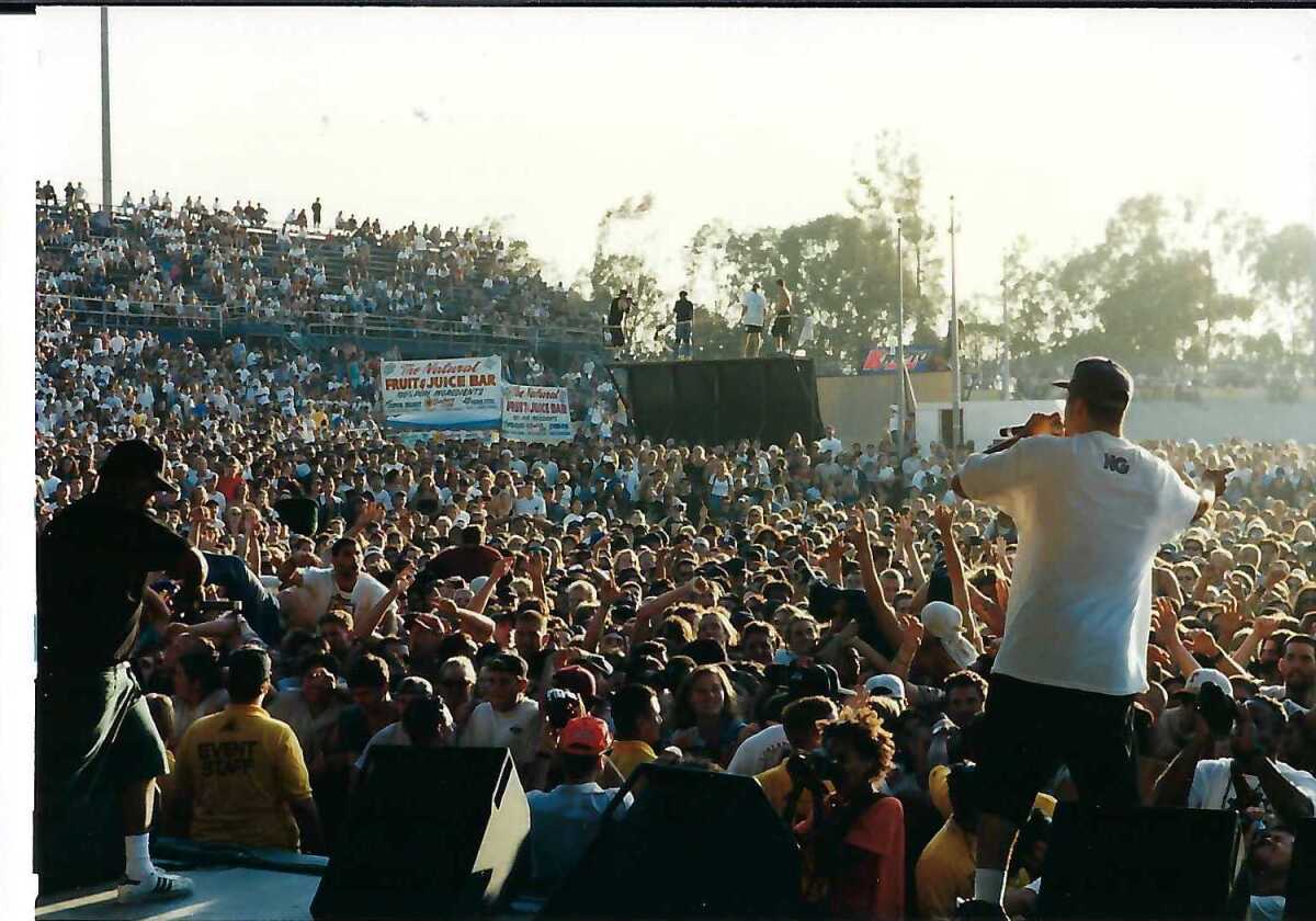 Cypress Hill onstage before a large audience at outdoor music festival Lollapalooza in 1995