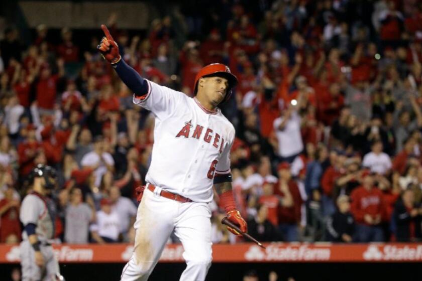 Angels infielder Yunel Escobar celebrates his walk-off single against the Indians during a game on June 11.