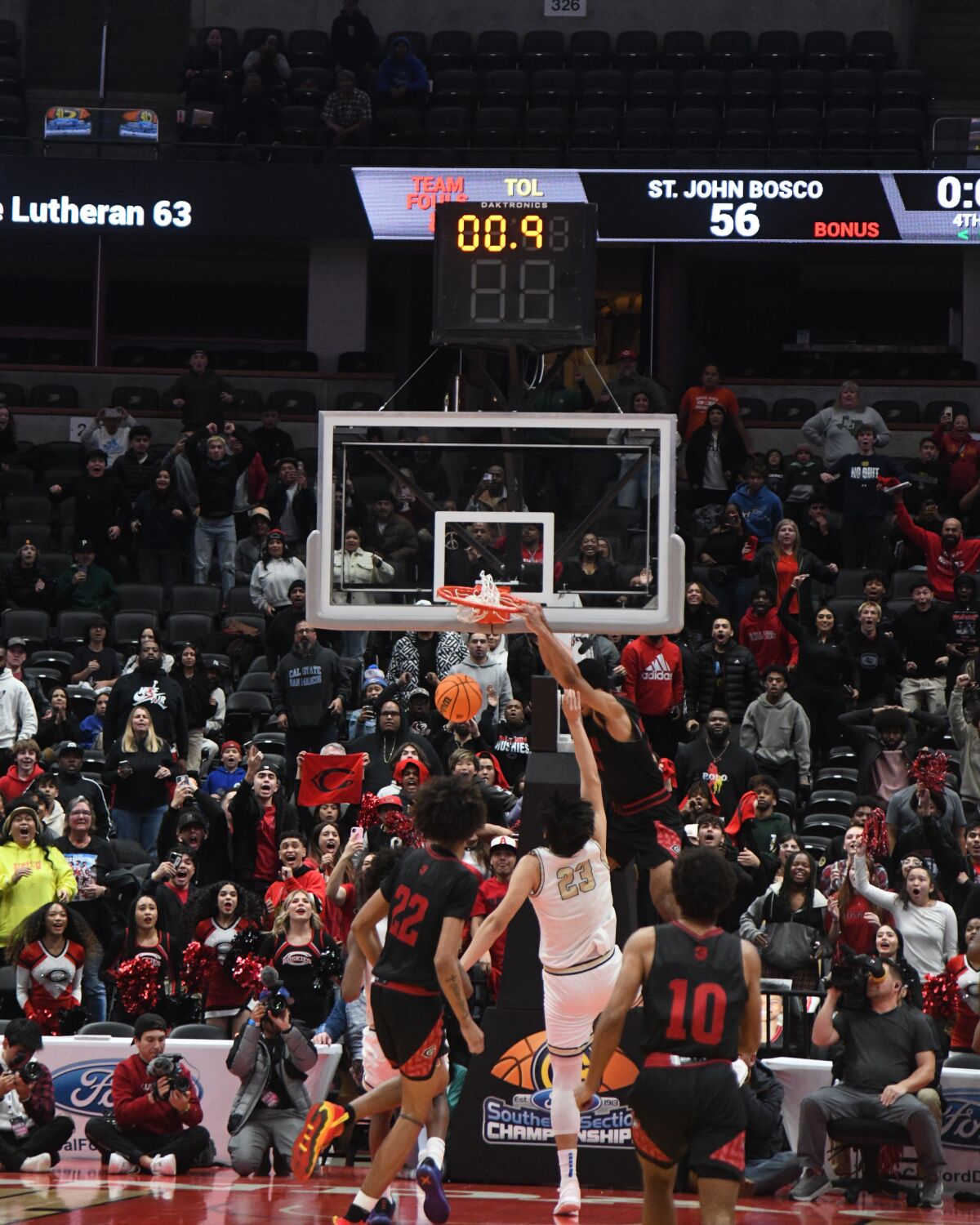 Aaron McBride dunks before time expires
