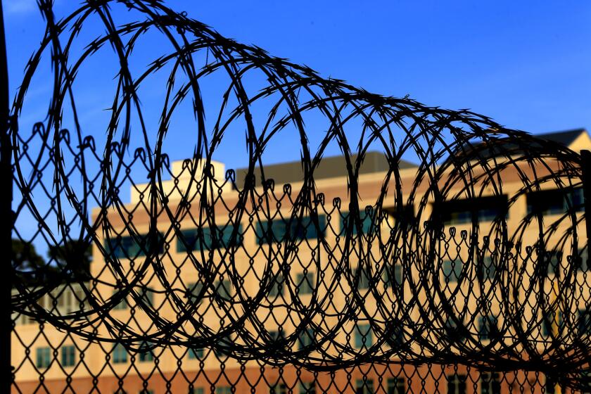 Razor wire encircles the exercise yard at San Quentin State Prison.