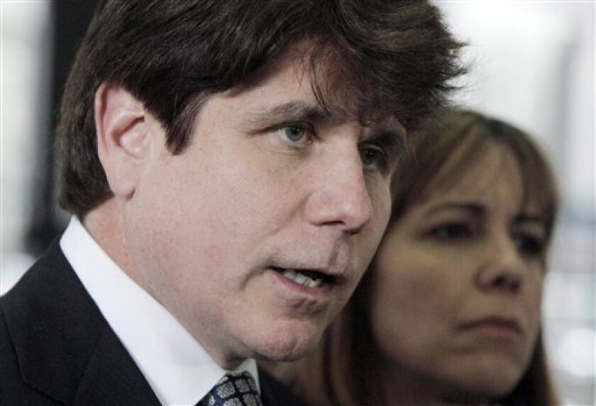 Former Illinois Gov. Rod Blagojevich addresses the media accompanied by his wife Patti, at federal court after opening arguments in his second corruption trial, Monday, May 2, 2011, in Chicago. Blagojevich who was convicted of one count of lying to the FBI in his original trial, faces 20 federal counts at his second trial, including allegations that he tried to sell or trade President Barack Obama's former Senate seat. (AP Photo/M. Spencer Green)